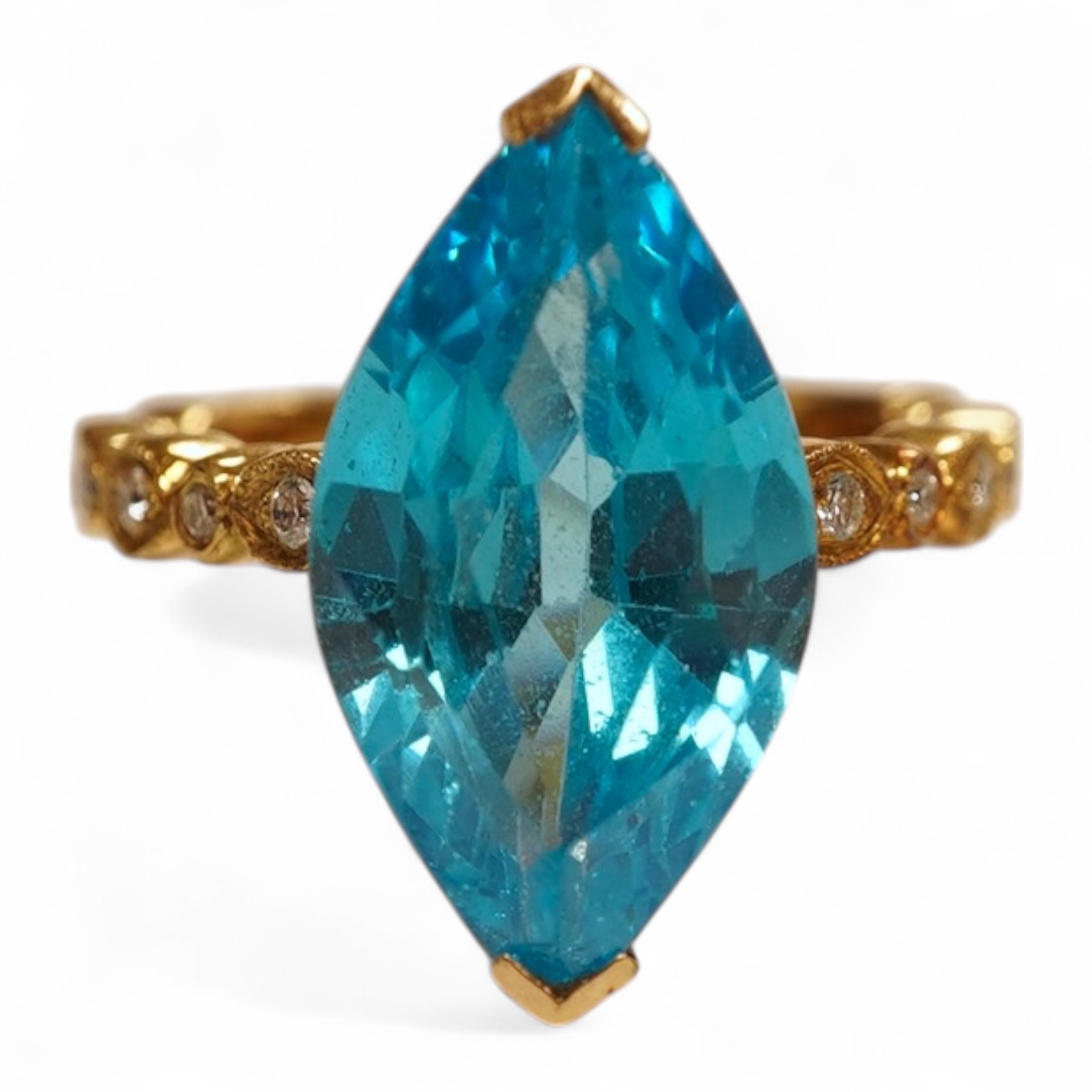 A cubic zirconia and diamond ring, set with a marquise-shaped blue cubic zirconia, to shoulders set with brilliant-cut diamonds, mounted in gold, size Q1/2, stamped 585, gross weight 8 grams, Condition: minor discolorati